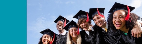 Diverse group of college graduates wearing caps and gowns